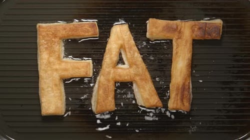 FAT letters fry in oil on a grill