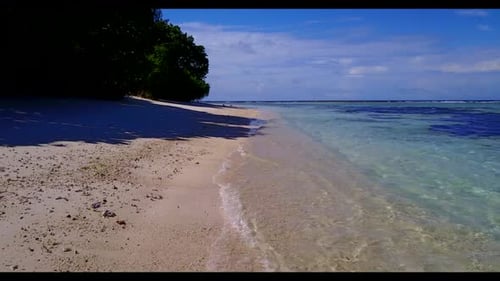 Aerial drone view scenery of marine shore beach voyage by clear water with white sand background of