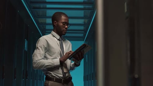 Professional IT Specialist Maintaining Operational Server Racks