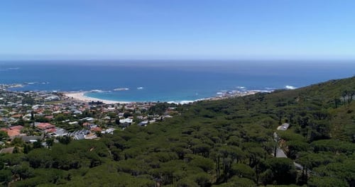 Aerial view of sea and city on a sunny day