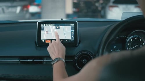 Hand Uses Car Navigation System