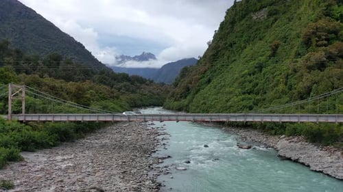 Car Driving over Bridge on New Zealand's West Coast