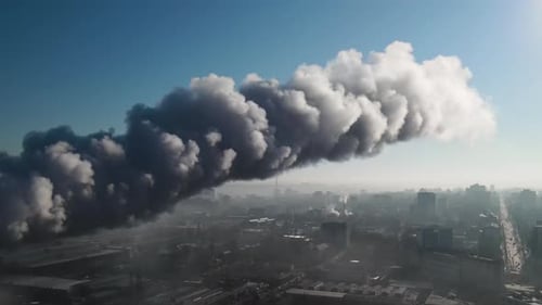 Aerial drone view of industrial smoke coming from pipe factory tube. City pollution idea