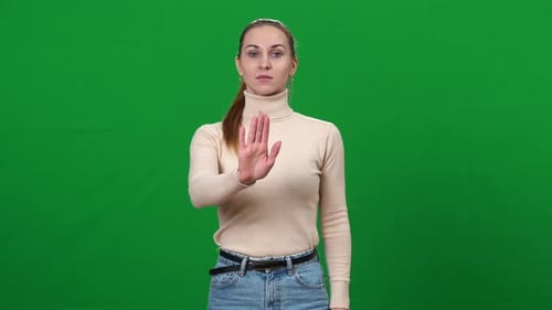 Woman Making Stop Gesture on Green Screen