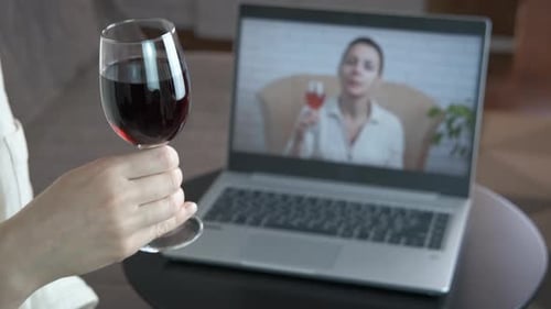 Virtual Wine Toast Over a Laptop