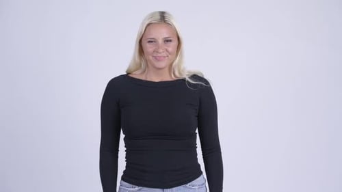 Young Woman Giving Thumbs Down Gesture