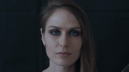 Portrait of a Beautiful Woman on a Black Background