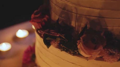 Elegant Wedding Cake with Flowers and Candles