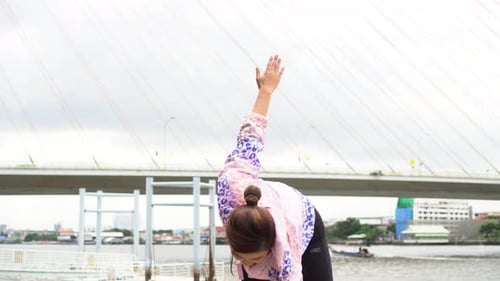 Woman Stretching Outdoors Before a Run