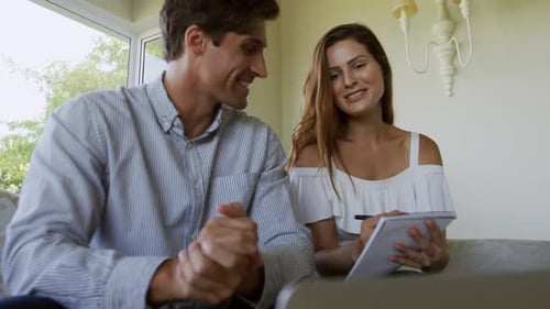 Couple at Home Writing Together