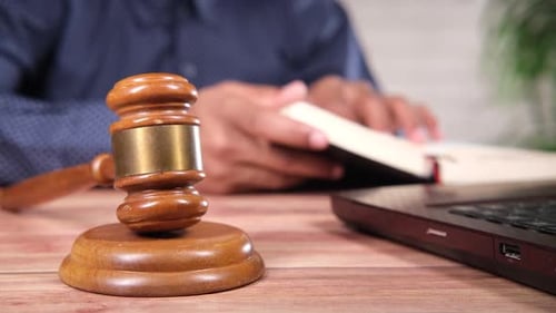 Close Up of Gavel and Book in Legal Setting