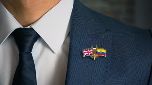Man Wearing Flag Pins in Corporate Setting