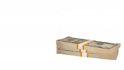 Many wads of money falling on table. 10 US dollar banknotes.