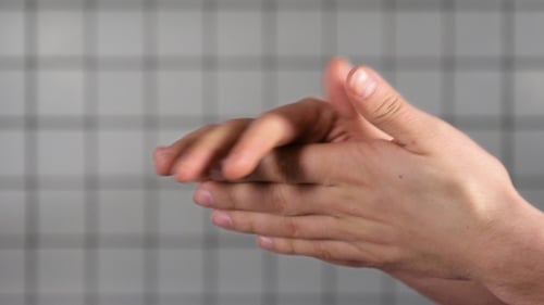 Doctor in a hospital using antibacterial sanitizer. Hands.