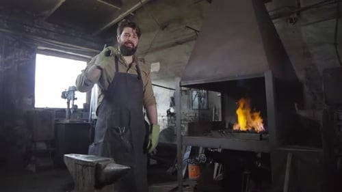 Handsome Blacksmith Standing in Smithy