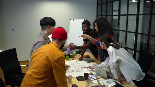 Diverse Team Collaborating on a Project in Office