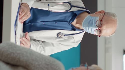 Senior Patient Consults with Doctor in Office