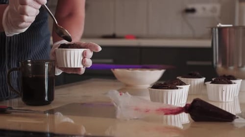 Pouring in the Cupcake Cherry Filling and Juice