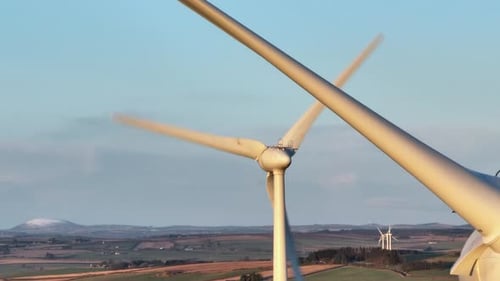 Wind Turbines Spinning in Rural Landscape