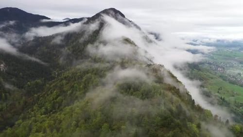 Fog Rolling Over Mountain Peaks Aerial View