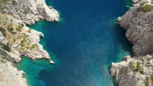 Yacht Sailing Near the Rocky Coast in Turkey