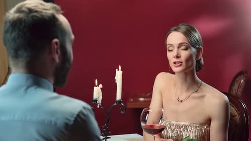 Couple Enjoying a Romantic Candlelit Dinner With Wine