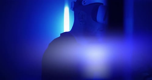 Man Exploring Virtual Reality Under Blue Illumination