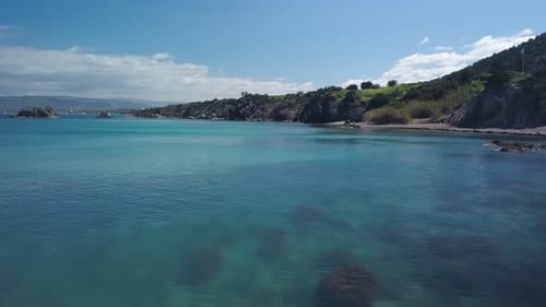 Drone Is Flying Over Beautiful Turquoise Sea Water and Picturesque Shore in Summer Day