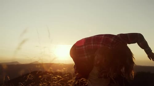 Couple Enjoying Golden Hour on Mountain Top