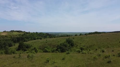 Aerial drone view of a flying over the rural agricultural landscape.