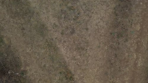 Mud road leads to Y crossing aerial 4K video