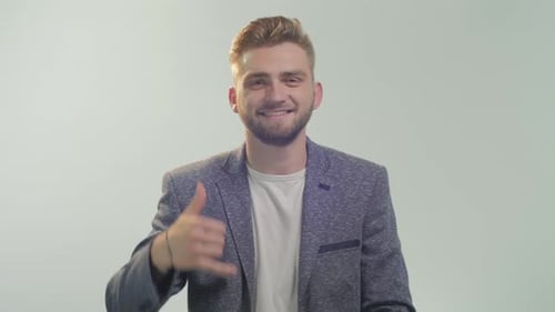 Man showing the "call me" sign