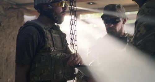 Soldier Showing Region Plan To Commander