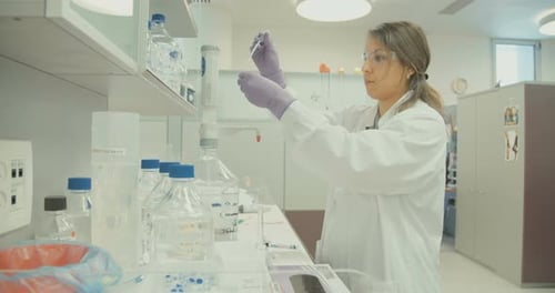 Woman Scientist Working in Bright Laboratory