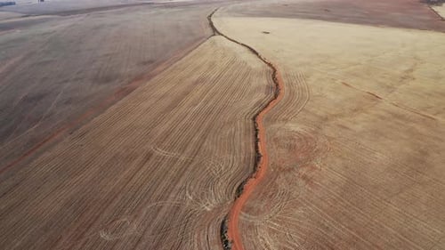 Drone Shot of Plowed Plain Fields By the Countryside in Africa