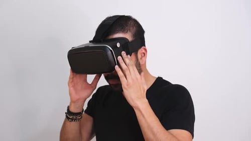 Man Putting on and Taking off VR Headset