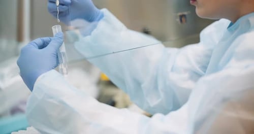 Scientist Works with Samples in a Laboratory