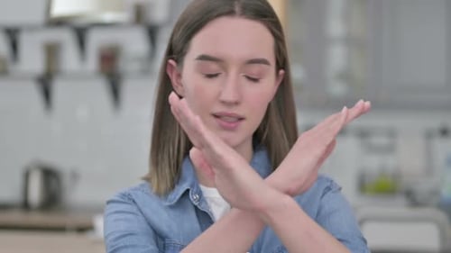 Woman Showing No With Crossed Arms Indoors