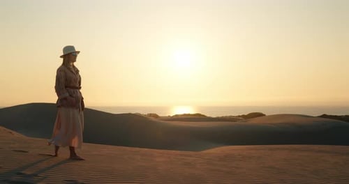 Female Traveller Walking on Sandy Beach