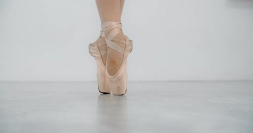 Ballet Dancer Feet in Pointe Shoes Close Up