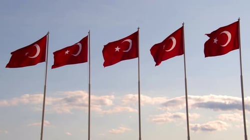 Turkish Flags Waving Against Blue Sky