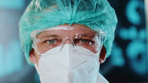 Male Doctor or Physician in Personal Protective Equipment in a Hospital Clinic