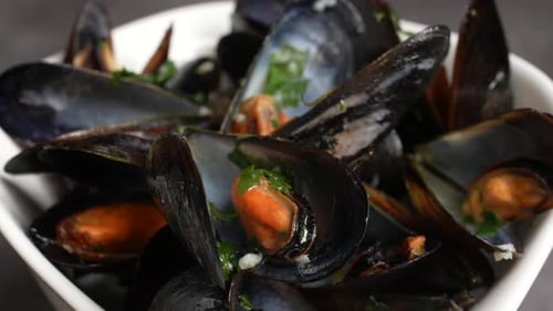 Bowl of Freshly Cooked Mussels with Parsley