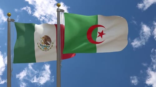 Mexican and Algerian Flags Waving Against Blue Sky