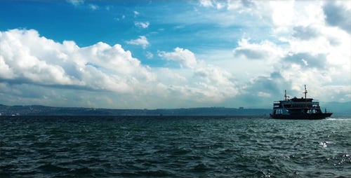 Ferry Boat Crossing the Ocean on Sunny Day