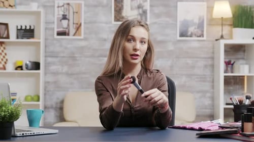 Young Woman Recording a Makeup Tutorial at Home