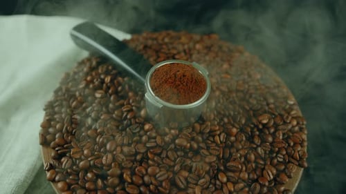 Coffee Beans and Ground Coffee with Smoke