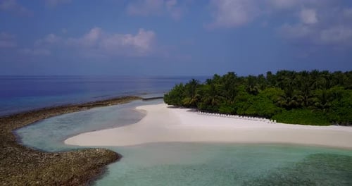 Wide overhead abstract shot of a sunshine white sandy paradise beach and aqua blue water background