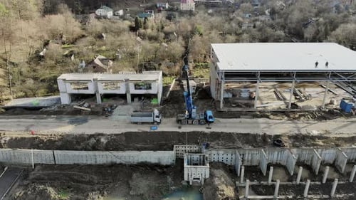 Flight Near the Unfinished Monolithic house, Builders Are Building a House
