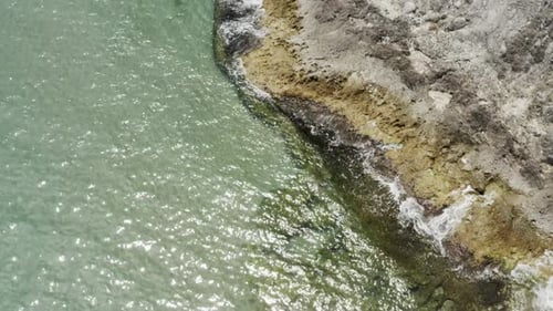 Clean Sea Waves And Rocks Aerial View
